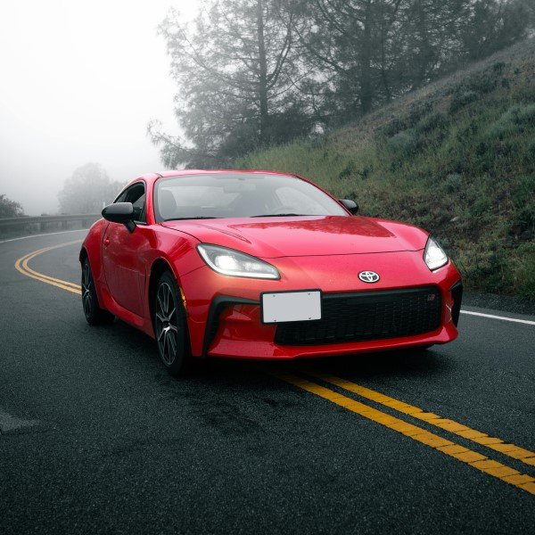 Red Toyota on a country road